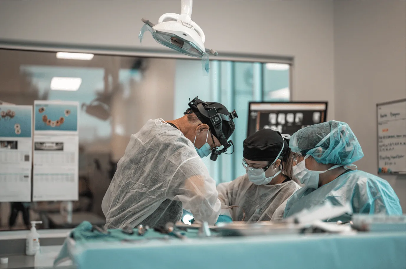 Specialist surgical team performing a Smileloc procedure